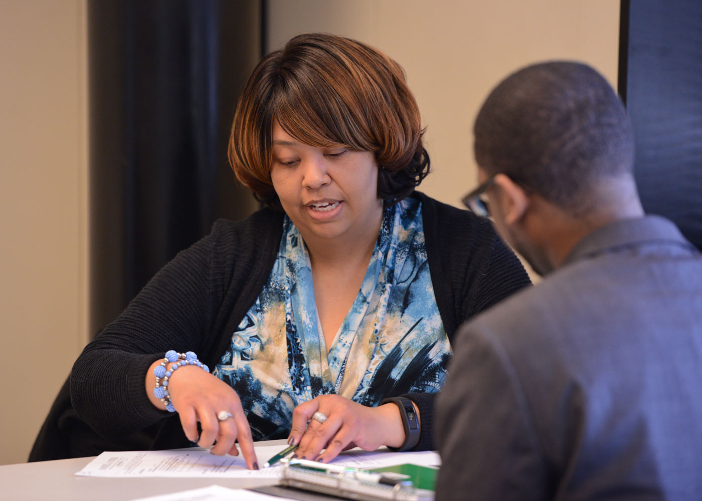 Image of a woman talking to a student