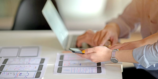 Person typing on a computer.