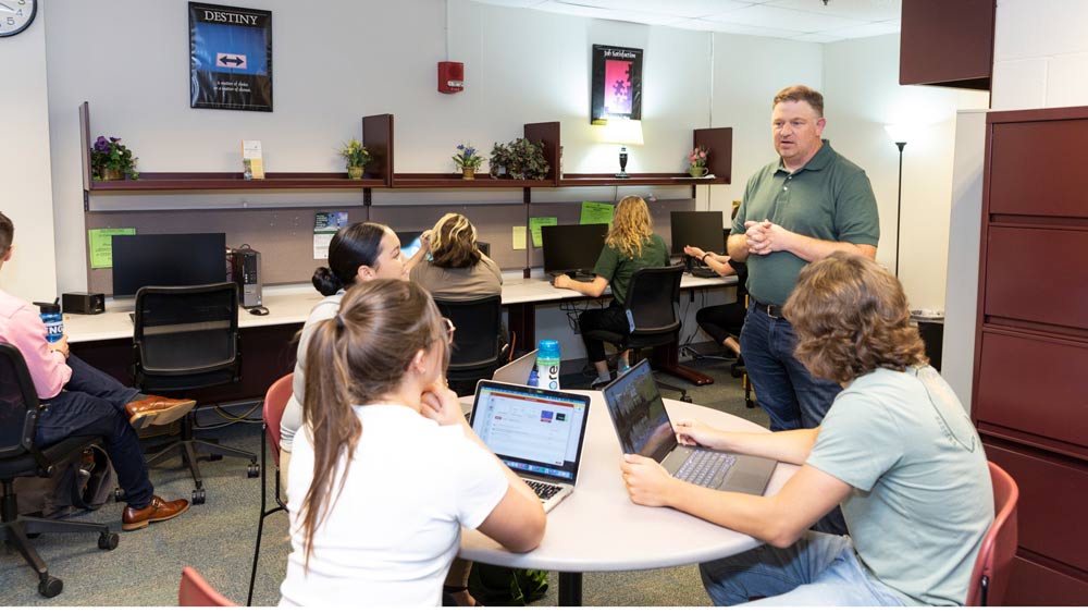 OCC academic advisor working with students