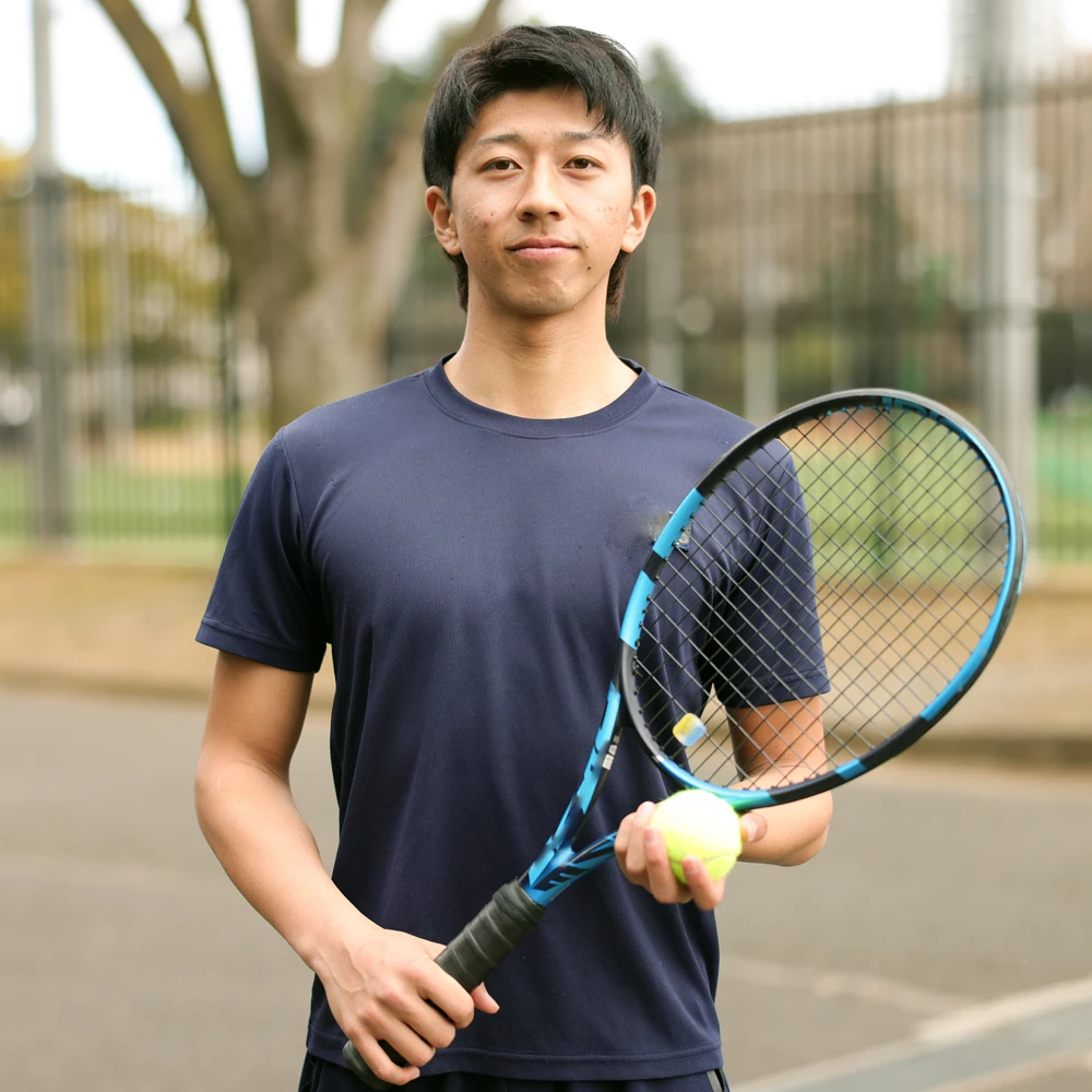 student holding a tennis racket