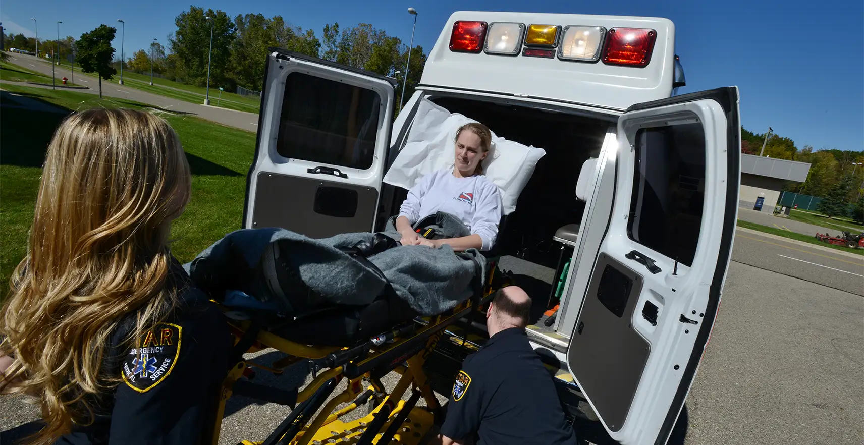 EMS unit loading patient into ambulance