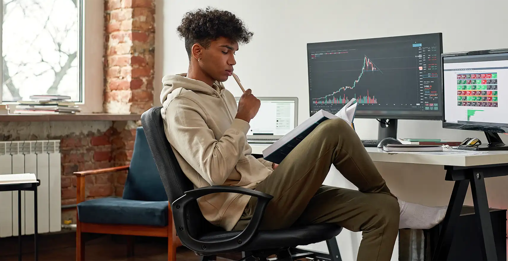 Photo of a Young Entrepreneur sitting at a desk