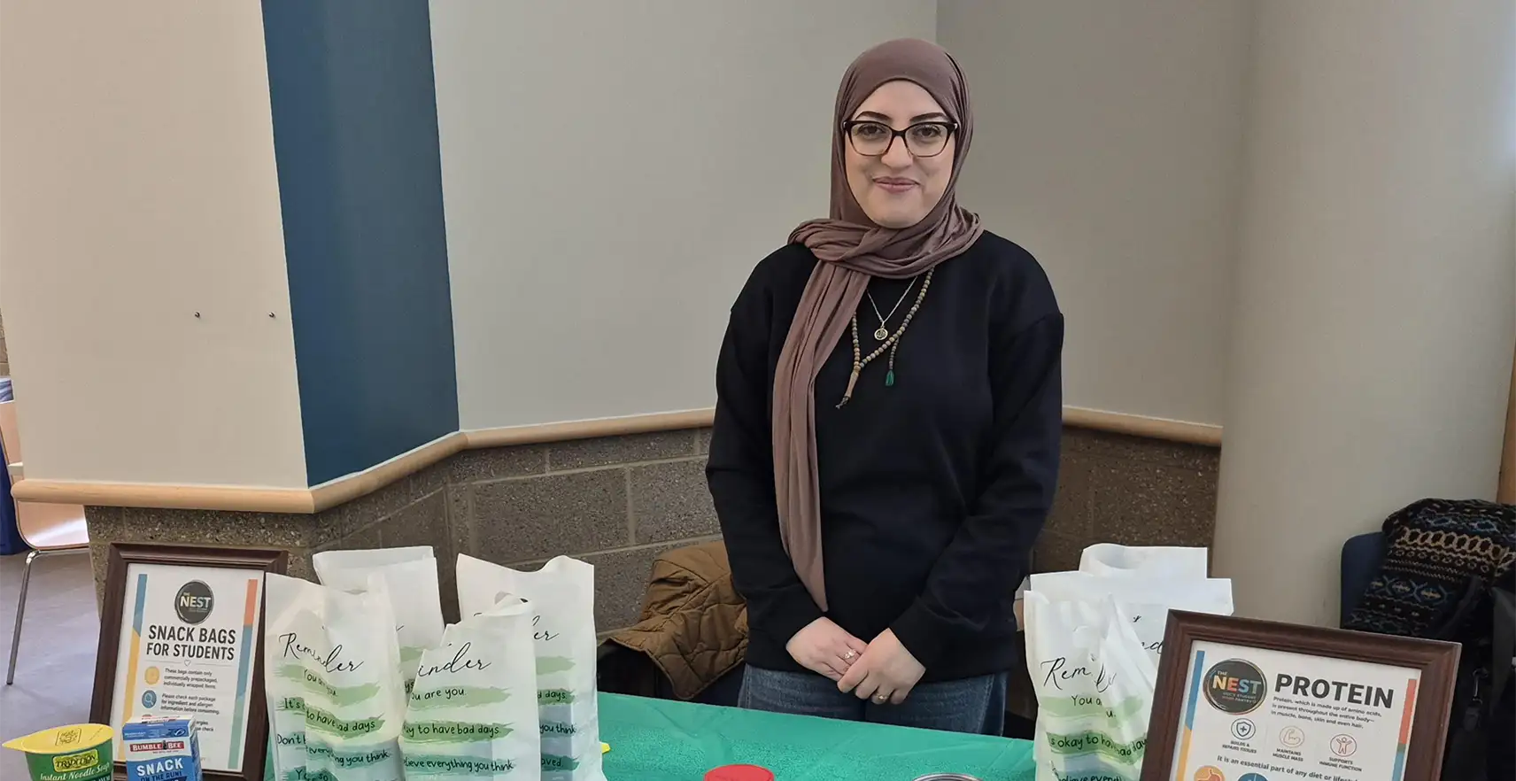 Alum standing at Nest table 