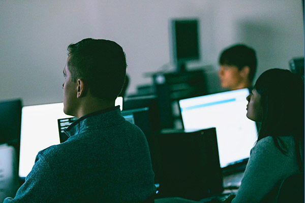 Students working on computers in a CIS classroom